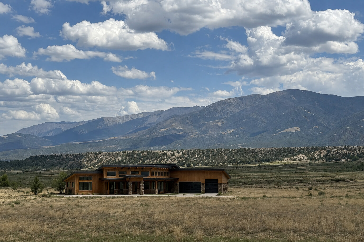 Wide Arkansas Valley mountain panorama showing the expansive setting that influenced the residence's orientation.