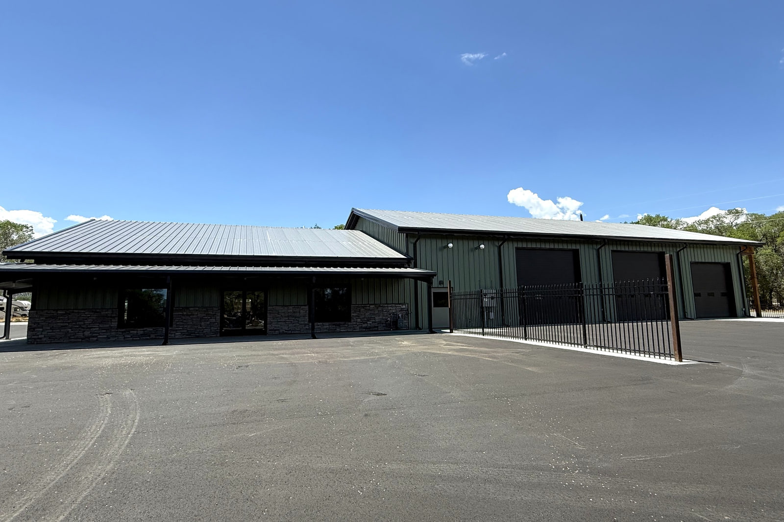 Overall view of the retail and office wing connected to the equipment-maintenance and storage building.