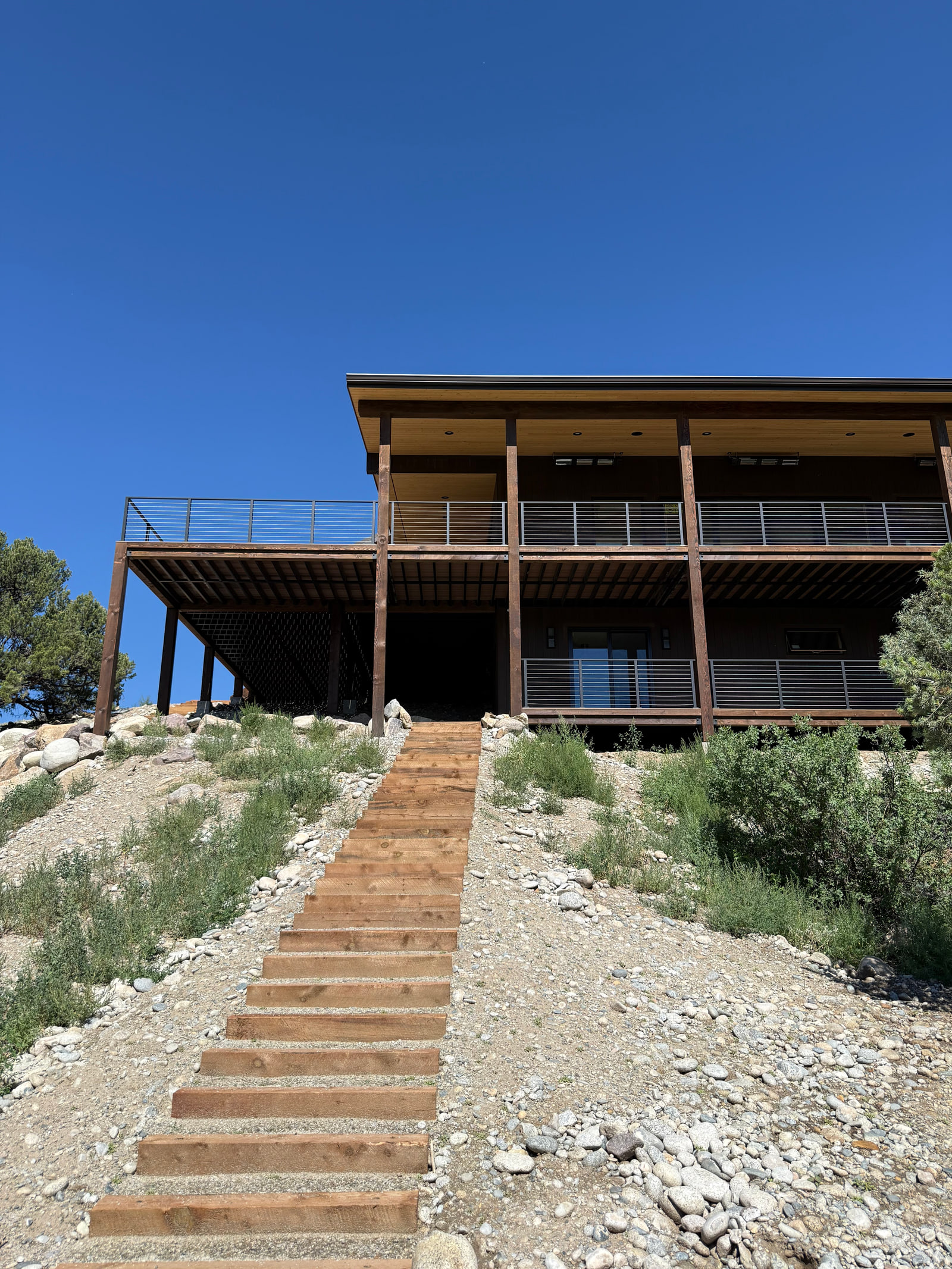 Landscaped stair connecting the riverbank, walkout level, and main residence.