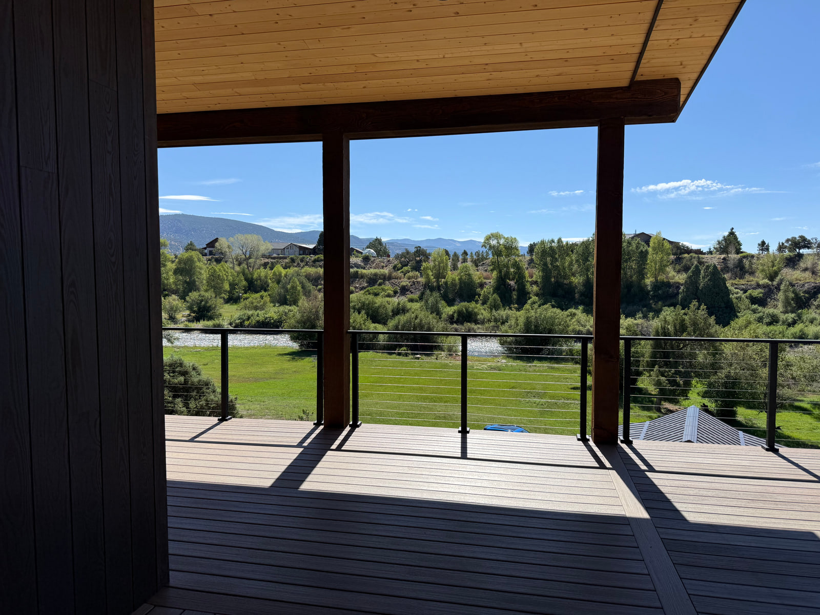 Covered deck overlooking the Arkansas River and surrounding landscape.